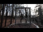 Male and Female Marines climb an obstacle while running t...